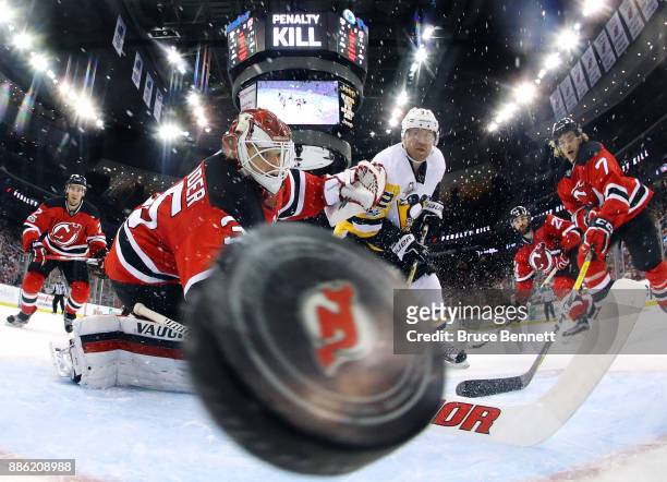 Patric Hornqvist of the Pittsburgh Penguins scores on the powerplay at 7:45 of the second period against Cory Schneider of the New Jersey Devils at...