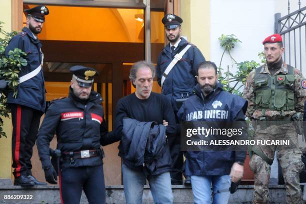 Filippo Bonnano , a man suspected of mafia association is escorted by carabinieri during a police operation, on December 5, 2017 in Palermo. Maria...