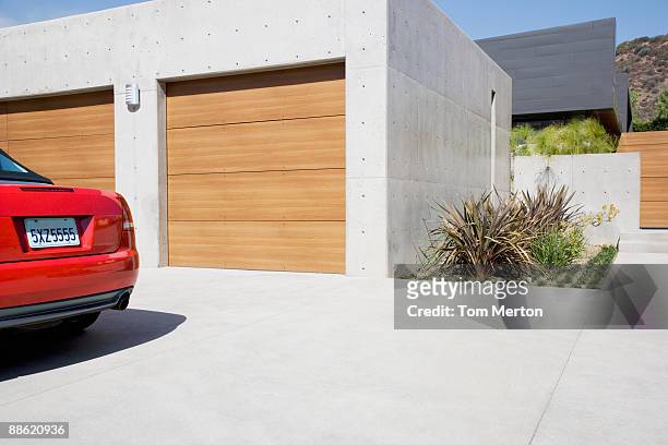 exterior of modern two-car garage - car on driveway bildbanksfoton och bilder