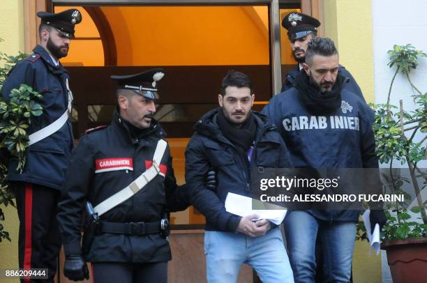 Ignazio Calderone , a man suspected of mafia association is escorted by carabinieri during a police operation, on December 5, 2017 in Palermo. Maria...