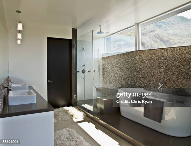 modern bathroom with soaking tub - bathroom counter stock pictures, royalty-free photos & images