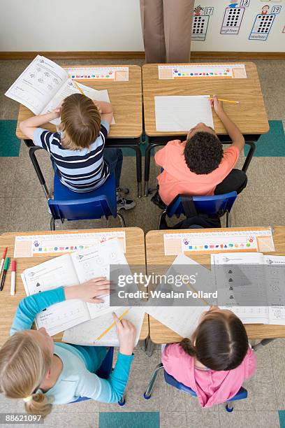 Understanding School Work Students Doing School Work In Classroom High-Res Stock Photo - Getty Images