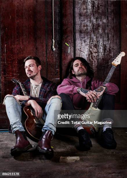 Portrait of English musicians Mike Duce and Ben Sansom, guitarists with rock group Lower Than Atlantis, photographed backstage before a live...