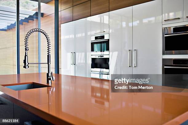 interior of modern kitchen with spray nozzle - spray nozzle stock pictures, royalty-free photos & images