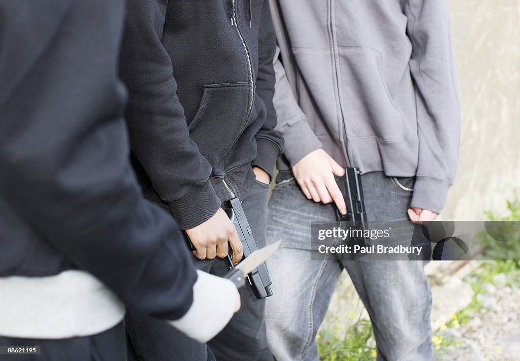 Men holding guns and knife