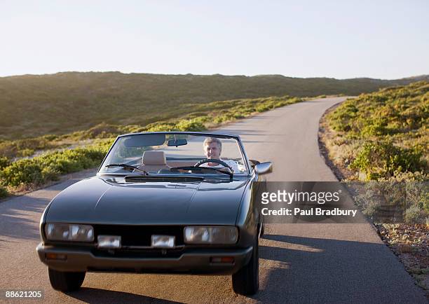 man driving convertible - front view stock pictures, royalty-free photos & images