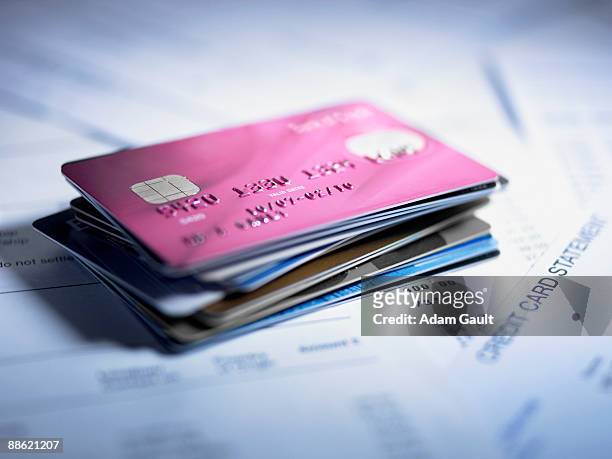 close up of stack of credit cards - credit card and stapel stockfoto's en -beelden
