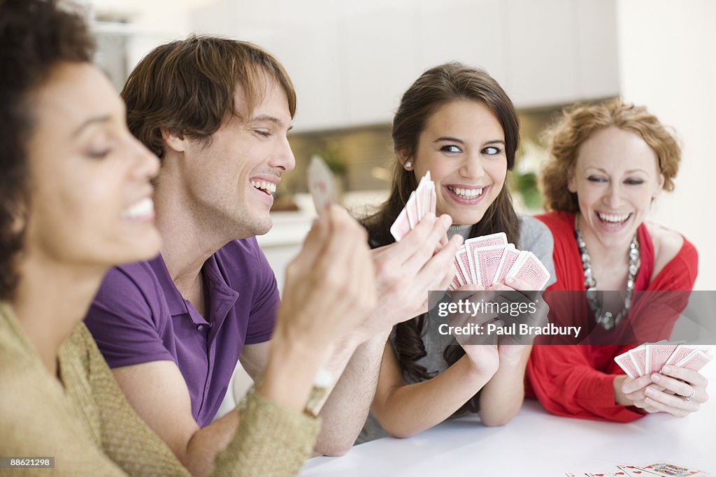 Friends playing cards together