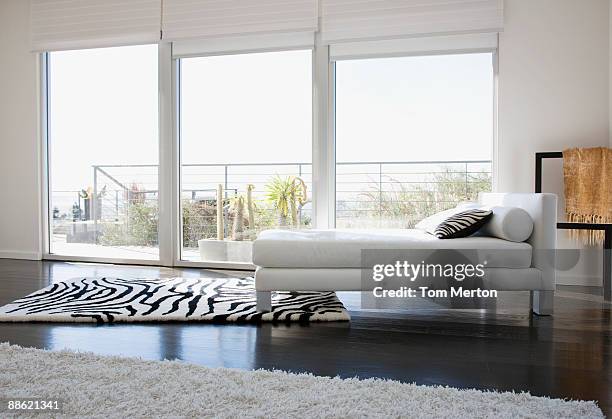 interior of modern living room with glass walls - animal pattern stock pictures, royalty-free photos & images