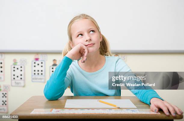 girl thinking and taking test - student day dreaming stock pictures, royalty-free photos & images