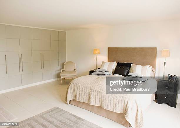 interior of off-white modern bedroom - cosy bedroom stock pictures, royalty-free photos & images