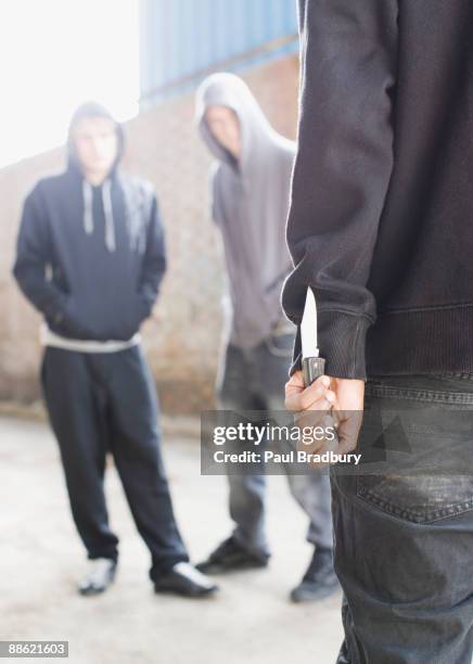 two men being confronted by man with knife - knife weapon stock pictures, royalty-free photos & images