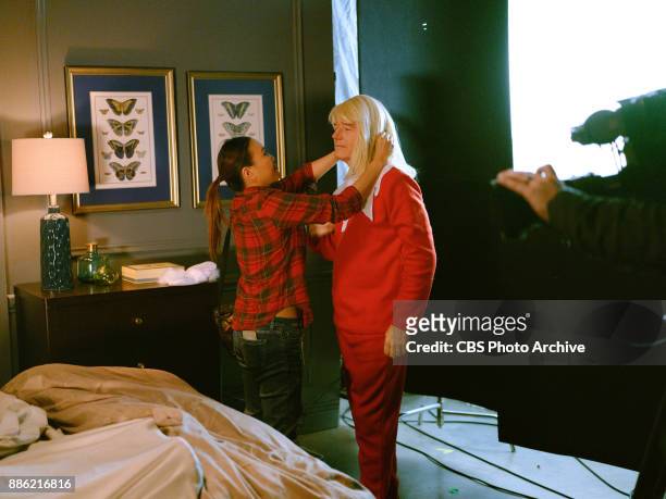 Makeup artist Diana Oh prepares Bryan Cranston during a sketch called Elf On A Shelf during "The Late Late Show with James Corden," Monday, December...