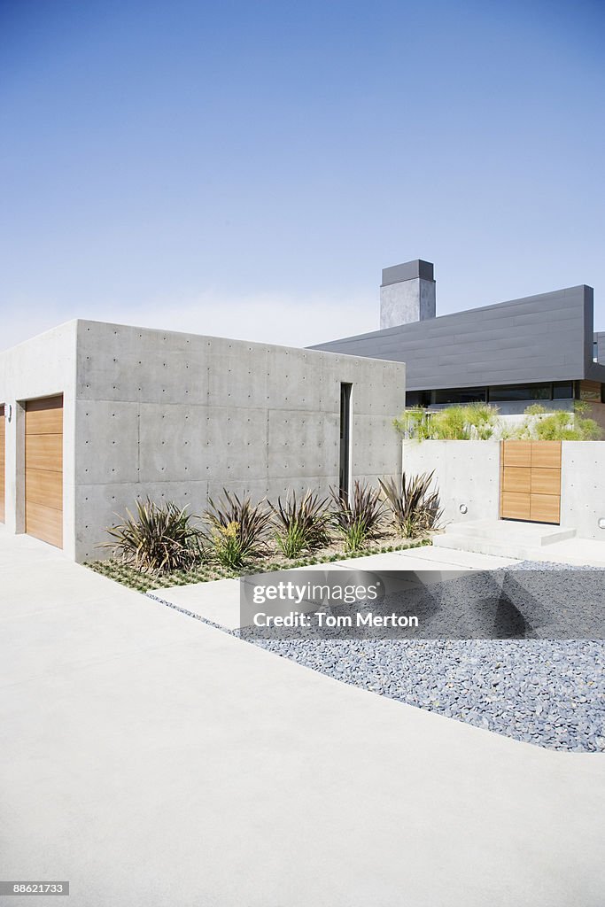 Exterior of modern two-car garage and house