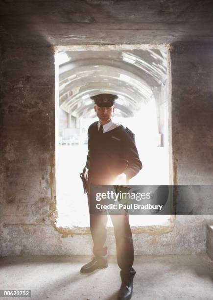 security guard with flashlight checking bunker - police entering stock pictures, royalty-free photos & images
