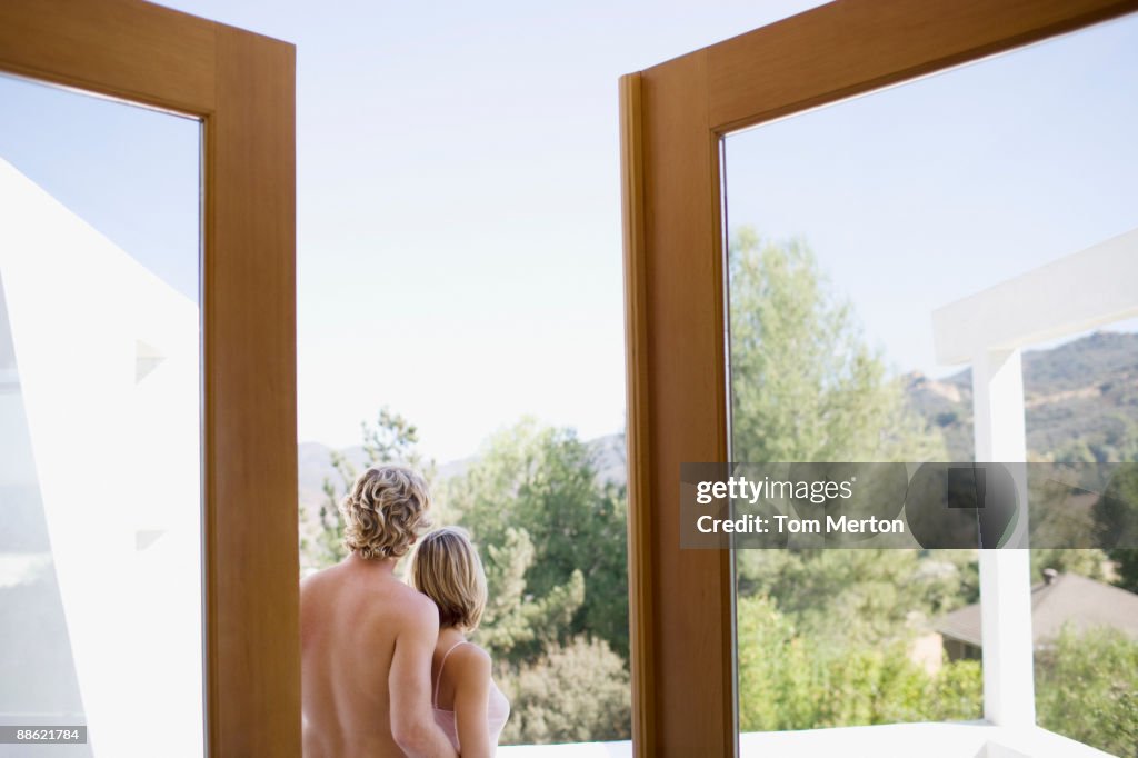 Couple standing on backyard patio