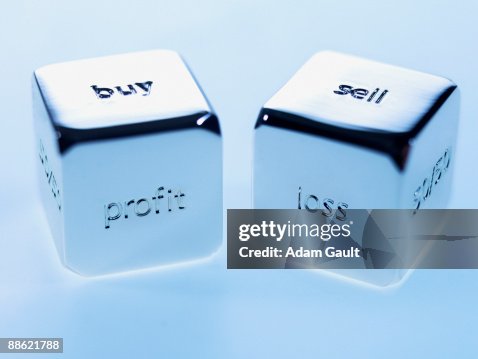 Close up silver cubes with sayings on them Close up silver cubes with sayings on them