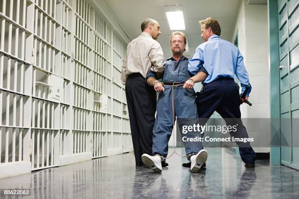 prisoner being dragged down corridor - death row stock pictures, royalty-free photos & images