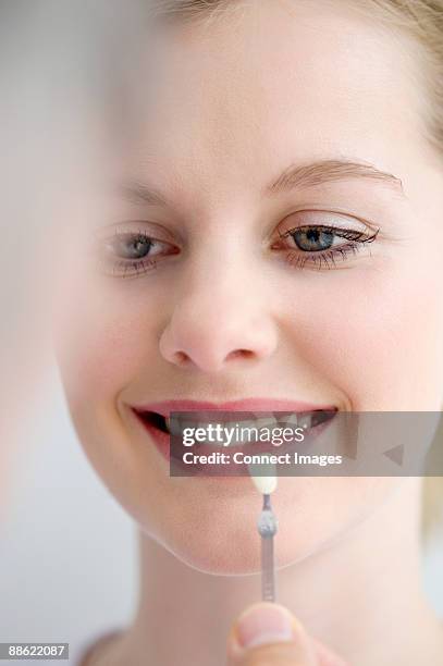 woman with tooth veneer - veneer stock pictures, royalty-free photos & images
