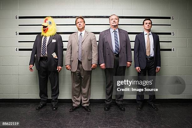 businessmen in lineup - police line up stock pictures, royalty-free photos & images