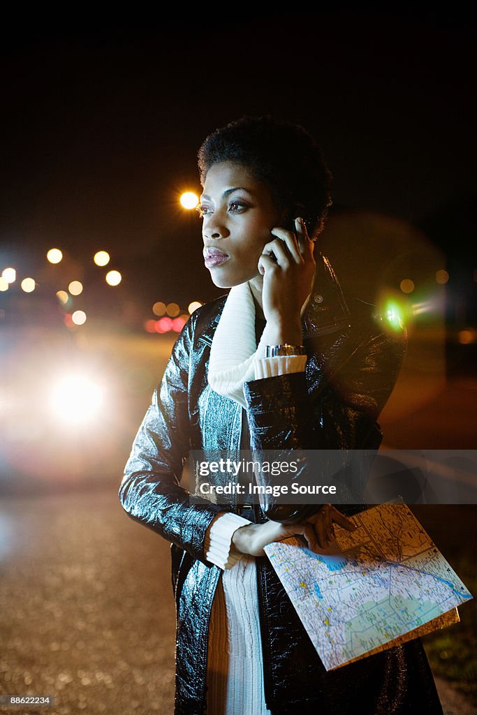 Woman on cellphone with map