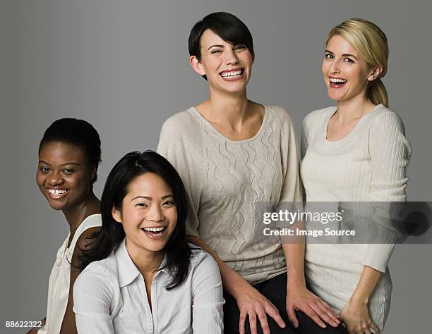 four women laughing - ethnicity fotografías e imágenes de stock