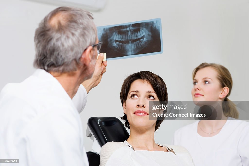 Dentist with patients x-ray