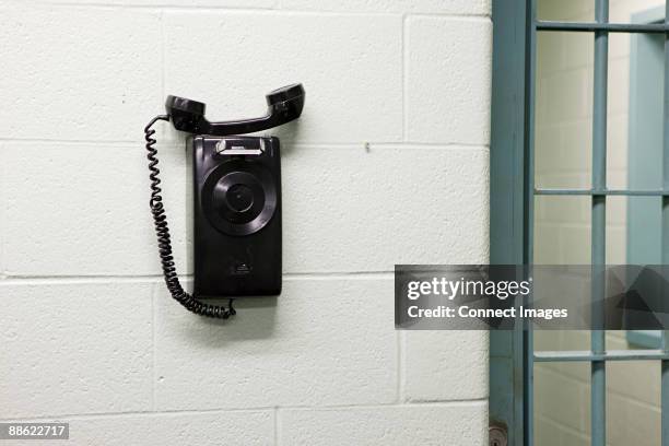 telephone in prison - prison-phone stock pictures, royalty-free photos & images