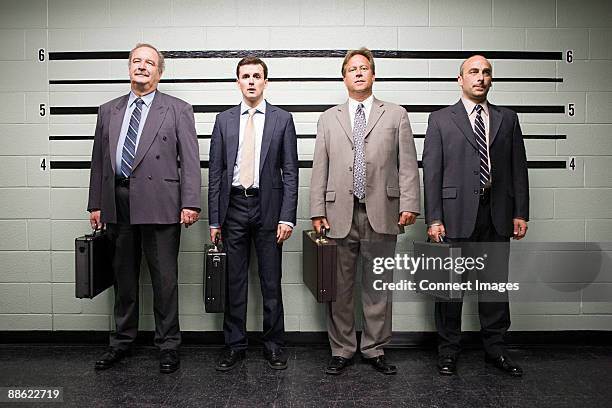 businessmen in lineup - sospetto foto e immagini stock