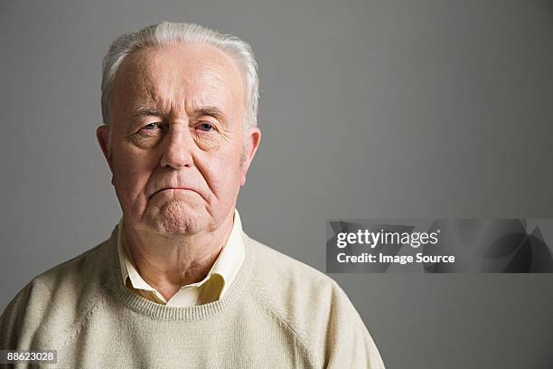 senior man frowning - 70 year old man stock pictures, royalty-free photos & images