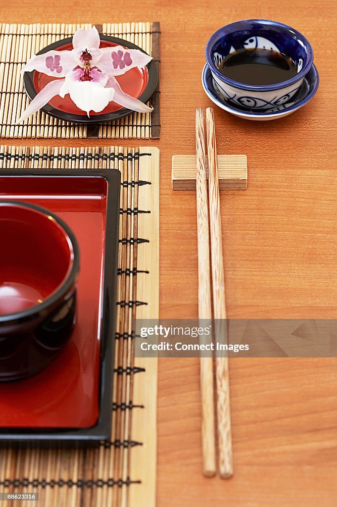 A dish and chopsticks on a table in a restaurant
