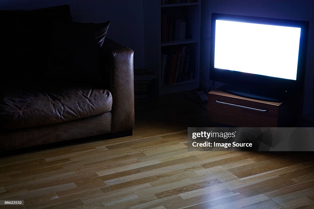 A tv on in a living room