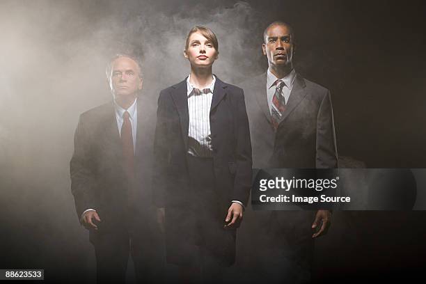 businesspeople in smoke - dry ice stock pictures, royalty-free photos & images