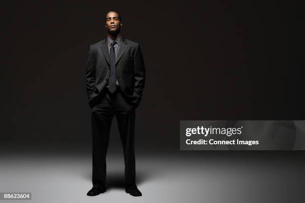 portrait of a businessman - man in black suit full body stock pictures, royalty-free photos & images