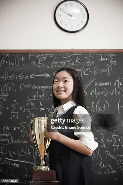 girl with trophy - school award stock pictures, royalty-free photos & images