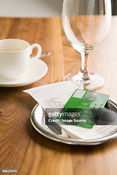 the bill on a table - rechnung restaurant stock-fotos und bilder
