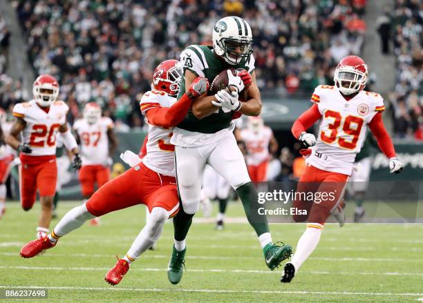 Jermaine Kearse of the New York Jets makes the catch as Steven Terrell of the Kansas City Chiefs defends on December 03, 2017 at MetLife Stadium in...