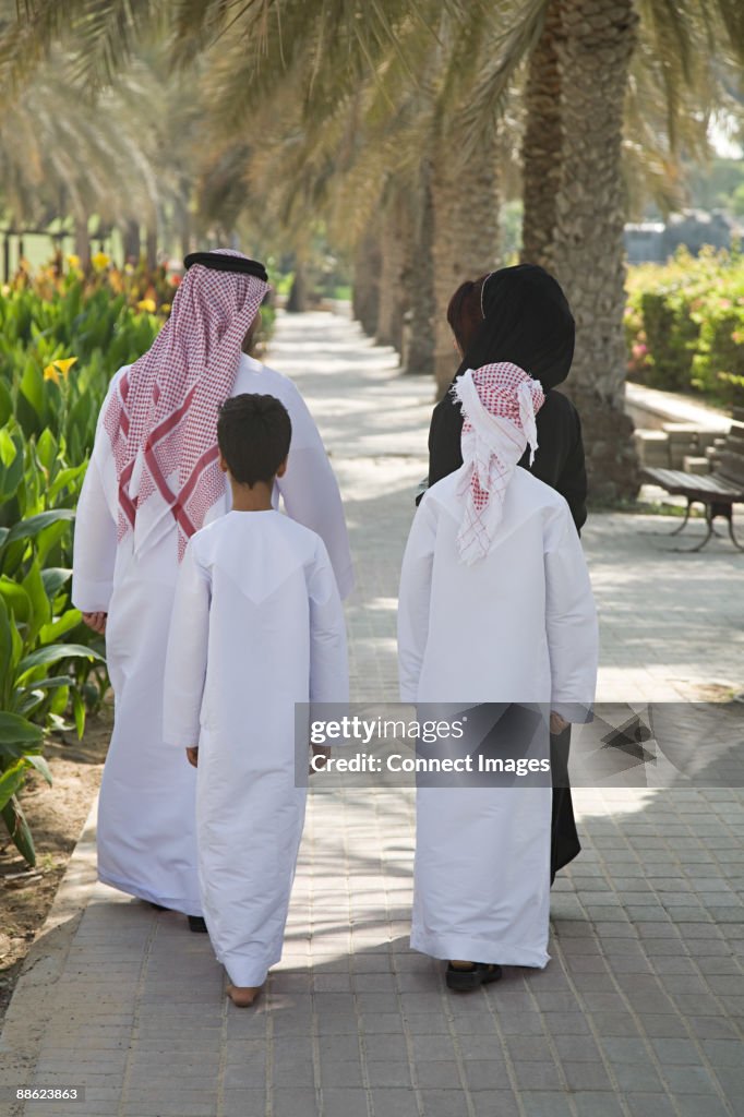 Rear view of a family walking
