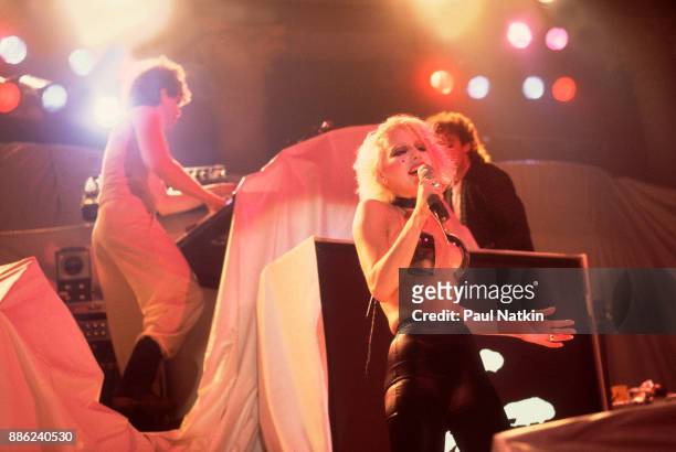 Singer Dale Bozzio, foreground, of the band Missing Persons performs in Milwaukee, Wisconsin, March 15, 1983. Two band members are partially obscured...
