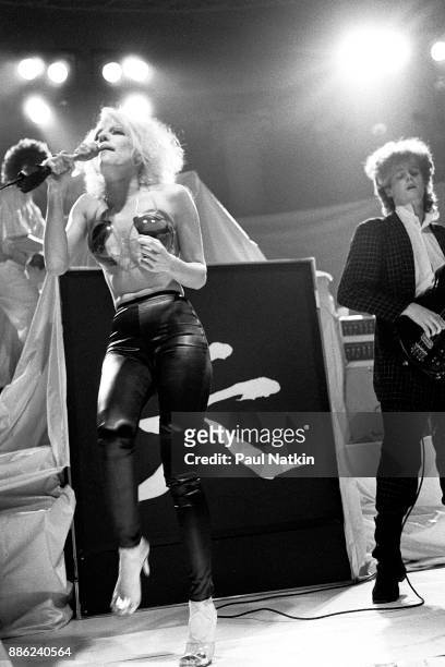 Singer Dale Bozzio, foreground, of Missing Persons performs in Milwaukee, Wisconsin, March 15, 1983. Band member on the right is unidentified.