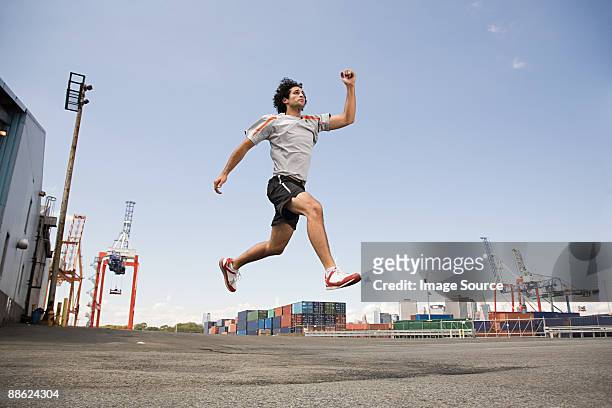 man athlete jumping - cargo shorts stock pictures, royalty-free photos & images
