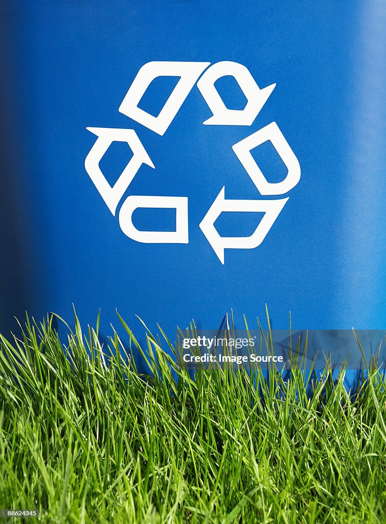 Recycling bin and grass