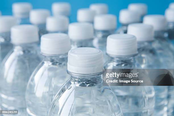 bottles of mineral water - sports bottle stock-fotos und bilder