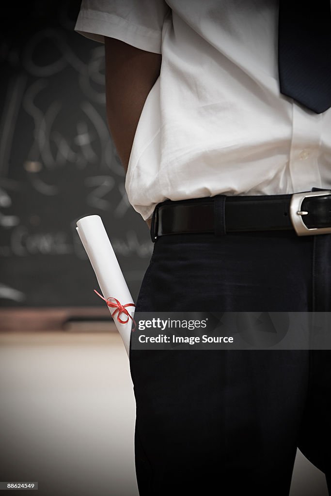 Student with scroll in pocket