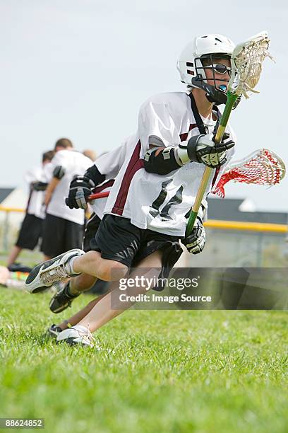 junior lacrosse players - lacrosse stock-fotos und bilder