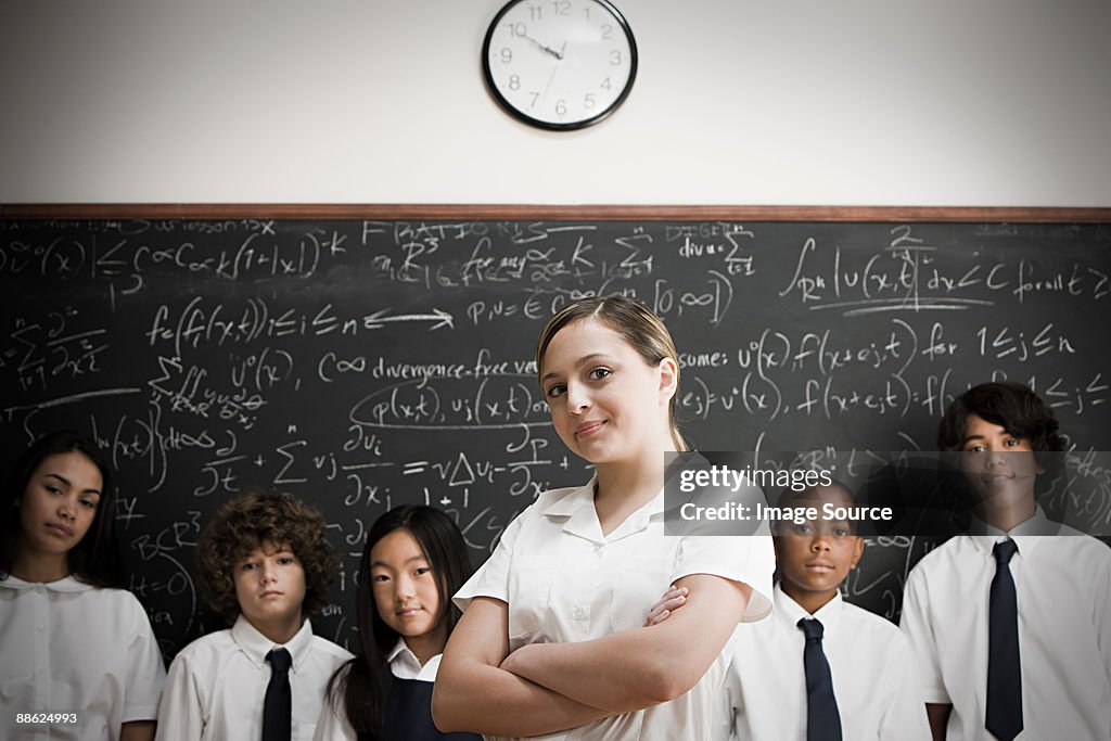 Students in front of blackboard