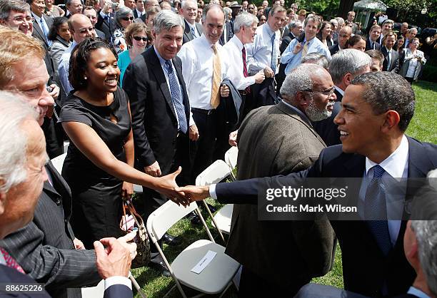 President Barack Obama greets guests after signing the Family Smoking Prevention and Tobacco Control Act during a ceremony in the Rose Garden at the...