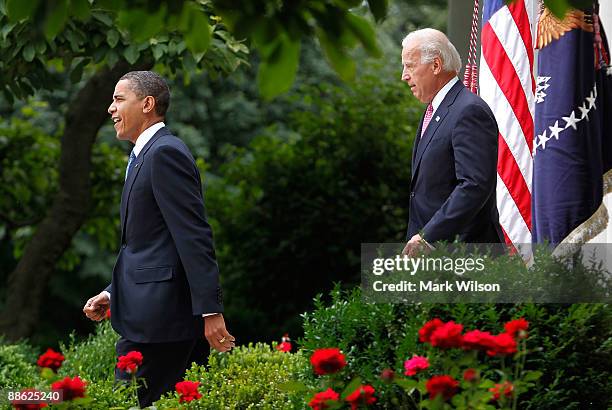President Barack Obama and Vice President Joseph Biden walk into the Rose Garden before signing the Family Smoking Prevention and Tobacco Control Act...