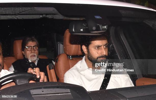 Bollywood actors Abhishek Bachchan and Amitabh Bachchan arrive at Shashi Kapoor's residence at Prithvi Theater, on December 4, 2017 in Mumbai, India....