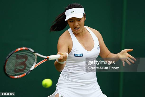 Yung-Jan Chan of Taiwan plays a forehand during the women's singles first round match against Marion Bartoli of France on Day One of the Wimbledon...